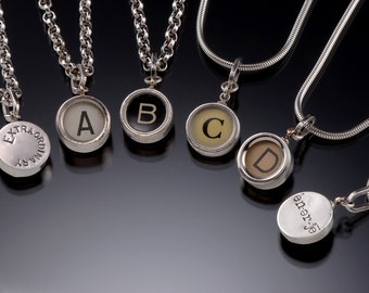 Authentic old typewriter keys set in silver. Click "Ask A Question" or "Convo"  Request your custom message on the back. Sold without chain