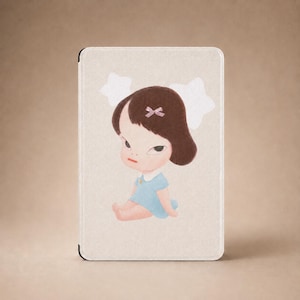 May include: A rectangular tablet case with a light beige textured surface featuring a centered illustration of a cartoon character with dark brown hair, a small pink bow, and a light blue dress, positioned against two white star shapes.