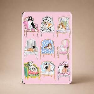 May include: A rectangular pink tablet case featuring a repeating pattern of various dog breeds sitting on ornate, colorful armchairs. The illustration includes nine distinct dogs, each positioned on a different chair style with unique upholstery.