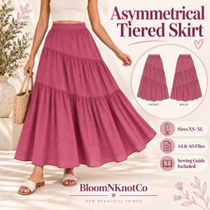 Puede incluir: Una falda asimétrica de niveles en color magenta con cintura alta y silueta acampanada. La imagen incluye el texto Asymmetrical Tiered Skirt, Sizes XS-XL, A4 & A0 Files, Sewing Guide Included y la marca BloomNKnotCo.