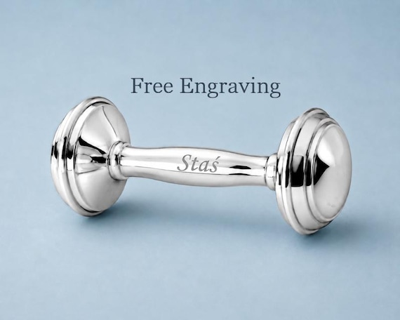 A hand-engraved sterling silver baby rattle that doubles as a heirloom keepsake — the kind of christening gift that gets kept for generations, not re-gifted.