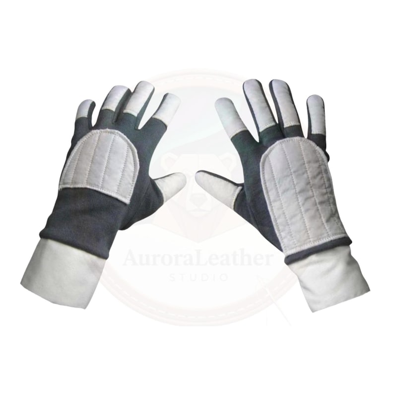 May include: A pair of gloves with a dark grey body, white fingertips, and white padded knuckles. The gloves have white cuffs and are displayed against a white background. The gloves are likely for protection or sports.