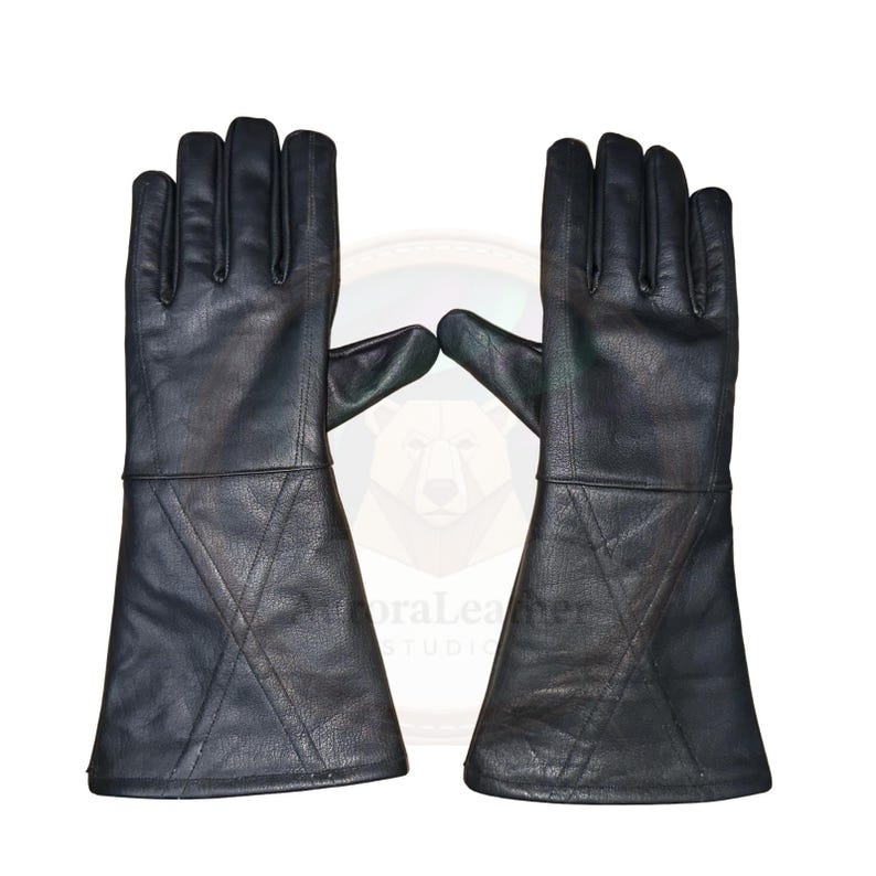 May include: A pair of black leather gloves with long gauntlets. The gloves have a classic design with stitched details on the gauntlets. The leather appears to be smooth and the gloves are designed for protection.