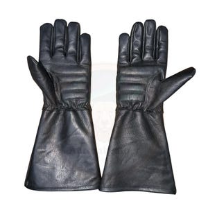 May include: A pair of black leather gloves with a gauntlet style cuff. The gloves have a quilted design on the back of the hand and fingers. The gloves are designed for protection and are likely used for work or sport.