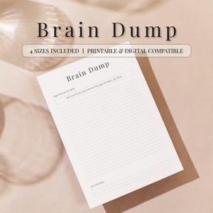 May include: A white Brain Dump notepad with lined pages, resting on a brown surface. The notepad has the title "Brain Dump" in a serif font. The image also includes the text "4 SIZES INCLUDED | PRINTABLE & DIGITAL COMPATIBLE".