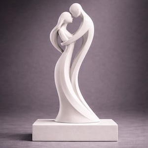 May include: A white sculpture of a couple embracing. The figures are stylized with flowing lines, suggesting movement and connection. The sculpture is mounted on a square, white base, and set against a neutral background.