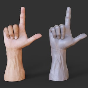 May include: Two hands, one in realistic skin tones and the other a gray sculpture, both forming the letter "L" with the index finger pointing up and the thumb extended. The hands are set against a dark gray background.