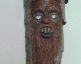 Partied out wood spirit hand carved wood wall hanging.