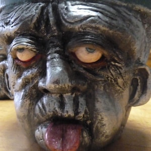 face planter terra cotta 6- inches of adorable hand sculpted polymer covered