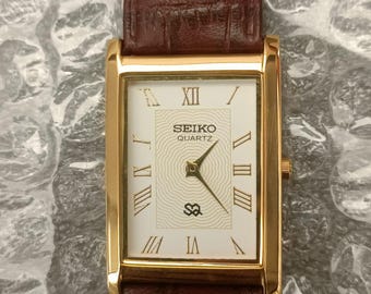 Vintage Seiko Slim Quartz White Dial Japan Made Stainless Steel Men's Wrist Watch