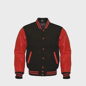 May include: Black and red varsity jacket with the text "Turner leather". The jacket features red leather sleeves, a black body, and red and black striped cuffs and hem. It has a button-up front and two front pockets.