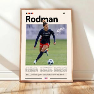 May include: A framed poster with the name "Rodman" in bold black text. The image shows a soccer player in a navy blue and red uniform, with a soccer ball on a green field. The poster includes a signature and the number 5.