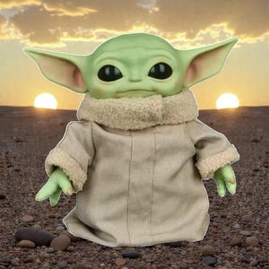 May include: A green-skinned, large-eared character doll wearing a tan coat with a fuzzy collar and cuffs. The doll has large black eyes and small green hands. The background features a sunset with two suns and a rocky surface.