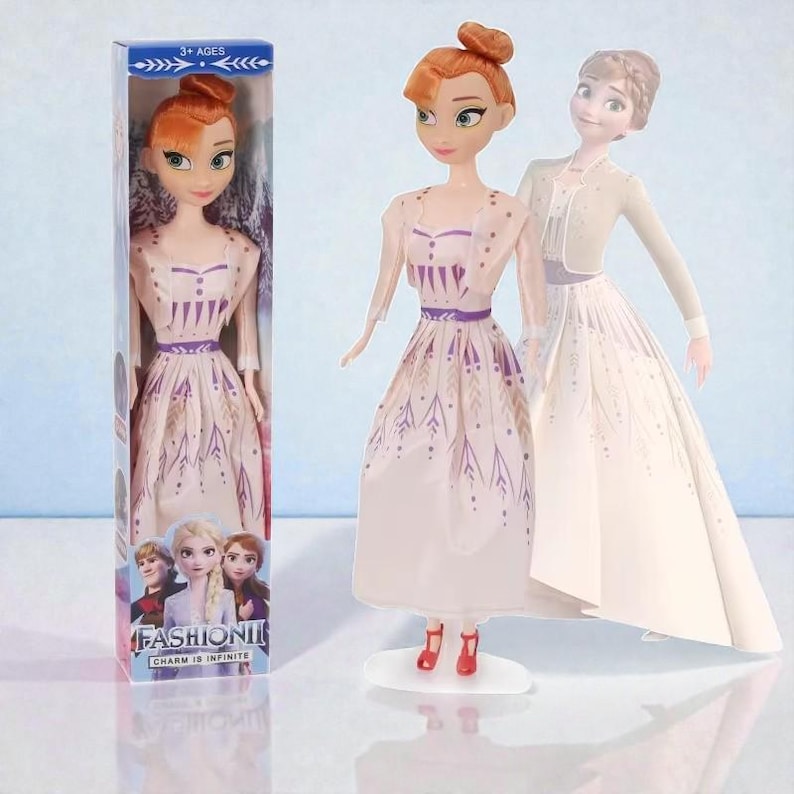 May include: A doll in a box and two other dolls are featured. The dolls have red hair and wear white dresses with purple accents. The box reads "FASHION! CHARM IS INFINITE" and "3+ AGES". The dolls are on a light blue background.