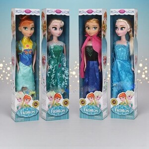 May include: Four fashion dolls in boxes. Each doll is dressed in a colourful gown and has long hair. The boxes have the word "FASHION" printed on them, along with images of the dolls. The dolls are in a variety of poses.