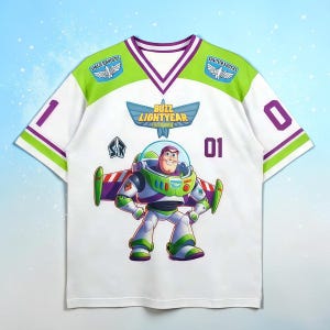 May include: White short-sleeve t-shirt featuring a large graphic of Buzz Lightyear from Toy Story. The shirt has green and purple accents, with the text "Buzz Lightyear" and "Space Rangers". Numbers "1" and "0" are on the sleeves.
