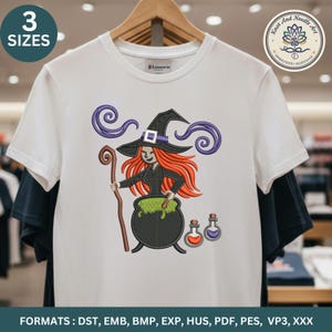 May include: White t-shirt featuring an embroidered witch design with orange hair, a black hat, and a cauldron. The design includes purple swirls and two potion bottles. The shirt has the text "3 SIZES" and "Knot And Needle Art Embroidery Workshop".