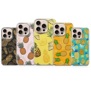 May include: Five phone cases with pineapple designs. The cases feature various colours, including black, pink, yellow, and teal. Each case has a different pineapple pattern, with some showcasing whole pineapples and others featuring slices.