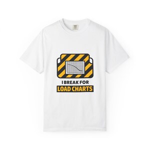May include: White t-shirt with a graphic design. The design features a yellow and black striped rectangle with a graph inside, and the text "I BREAK FOR LOAD CHARTS" in black and yellow.