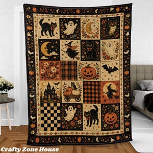 May include: A rectangular throw blanket featuring a grid of Halloween-themed illustrations including black cats, ghosts, pumpkins, a witch on a broomstick, an owl, a crescent moon, a haunted house, and plaid patterns, all framed by a decorative border.
