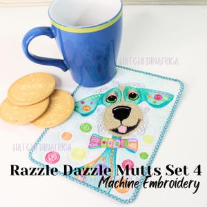May include: A colorful embroidered coaster featuring a cartoon dog with a blue, pink, and green bow tie. The coaster is on a white surface with a blue mug and biscuits.