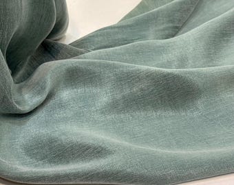 Tela de Cupro Lyocell para vestidos - Material verde clásico, suave y fluido.