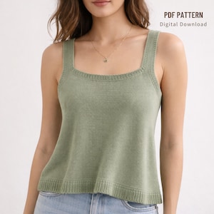 May include: A sage green knitted tank top with a square neckline. The top features a ribbed hem and straps. The text "PDF PATTERN Digital Download" is in the upper right corner. The top is worn with blue jeans.