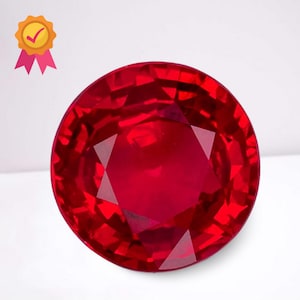 May include: A faceted, round-cut ruby gemstone, displaying a deep red hue. The gem is set against a white background, with a gold seal of approval in the upper left corner. The ruby's facets reflect light, creating a brilliant appearance.