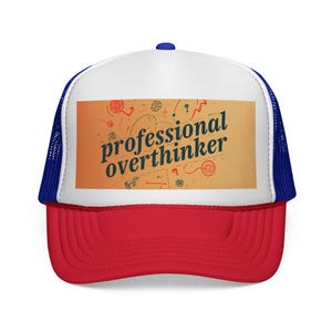 May include: A red, white, and blue trucker hat with the text "professional overthinker" on a tan rectangle. The hat has a red brim, a white front panel, and a blue mesh back. The text is in a bold, sans-serif font.