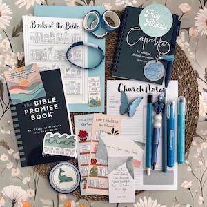 May include: A collection of religious stationery including a Bible Promise Book, a Church Notes pad, a spiral notebook with the text Capable, various bookmarks, stickers with inspirational quotes, blue washi tape, pens, and a blue butterfly clip.
