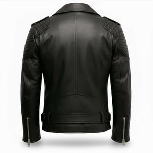 Man wearing black leather biker jacket with quilted sleeves, asymmetrical front zipper and belted waist in an urban evening setting.