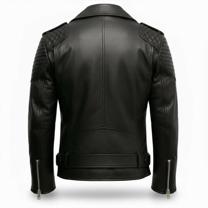 Man wearing black leather biker jacket with quilted sleeves, asymmetrical front zipper and belted waist in an urban evening setting.