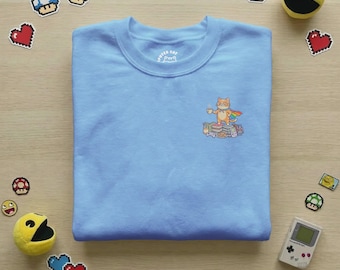 Cozy Cat Graphic Unisex Sweater | Gamer & Bookworm Tee | Cottage Core Aesthetic | Cosy Gaming Wear | Faux Embroidery