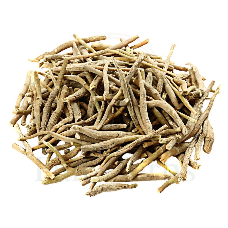 Whole dried Ashwagandha roots on rustic table, raw Withania somnifera herb for herbal use