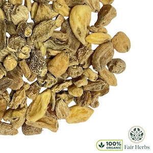 May include: Close-up of a pile of dried, beige-colored herbs. The herbs have various shapes and textures, with some appearing elongated and others more rounded. The image includes a green and white logo that says "100% ORGANIC Fair Herbs."