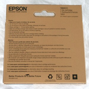 May include: A brown cardboard box with a white label that says "EPSON EXCEED YOUR VISION". The box contains a 14ml ink cartridge for an Epson printer. The label also includes the product number T324820 and the text "1 Ink cartridge, 1 Cartouche d'encre".