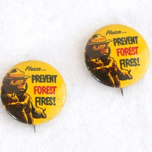 May include: A rustic wooden sign with the text "Welcome to our home" in white lettering. The sign features a distressed finish and a simple, inviting design, perfect for front door decor.