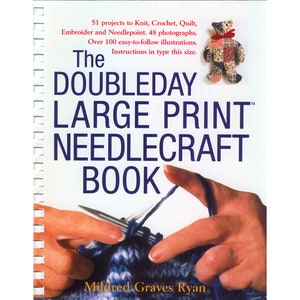 May include: The Doubleday Large Print Needlecraft Book with over 100 easy-to-follow illustrations. The book cover features a close-up of a person knitting with needles and yarn.