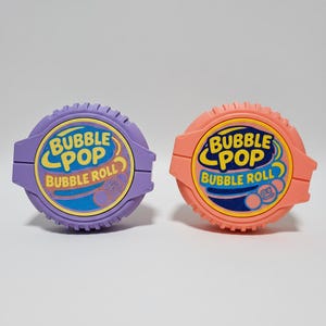 May include: A set of three ceramic mugs with a speckled, matte finish. The mugs are in shades of cream, light gray, and dark gray. Each mug has a simple, minimalist design, perfect for coffee or tea.