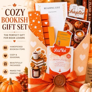 May include: A gift set in a light orange envelope with white hearts, containing a reading list, a star-patterned bookmark, orange sticky notes, a Just One More Chapter pin, a photo of pumpkins and coffee, a Yogi Tea bag, and a sticker of books.