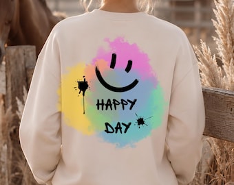 Super bequemes Sweatshirt Happy Day avec Smiley-Motiv et Aquarell-Spritzern