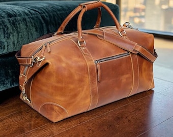 A personalized full grain leather duffel bag, handcrafted in vintage style and designed for use as a gym or weekender duffle bag