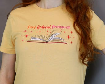 Fiery Redhead Protagonist organic cotton women's T-shirt, open book graphic, bookworms, film fans, storytellers