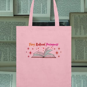 Fiery Redhead Protagonist organic tote bag, open book graphic, bookworms, film fans, storytellers, ginger gift idea