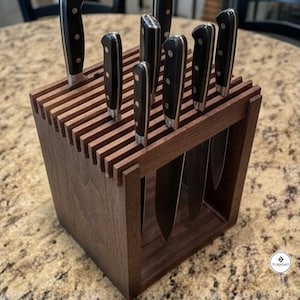 May include: A dark brown wooden knife block with a slatted top design holding seven kitchen knives. Each knife features a black handle with three silver rivets. The block has an open frame structure, and a small logo reading Furniast is visible.