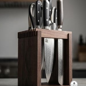 May include: A dark brown wooden knife block holding a collection of kitchen knives and kitchen shears. The block features a rectangular frame with vertical slats on top. Several knives with black handles and silver blades are visible in the block.