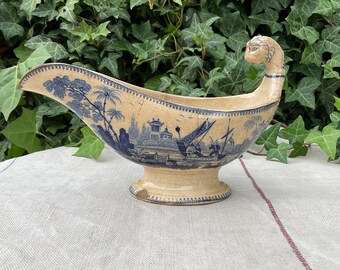 French vintage white faience sauceboat with blue decorations, Handmade, early 19th, lion head