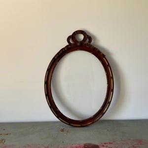French vintage very large frame in wood, with ribbon and knot, 1900 Handmade, with oval glass, 25.78 inches