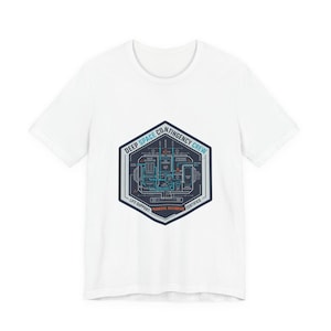 May include: White t-shirt with a hexagonal graphic that reads "DEEP SPACE CONTINGENCY CREW". The graphic shows a detailed diagram with blue and white lines, and the words "LIFE SUPPORT", "MANUAL OVERRIDE", and "CERTIFIED".