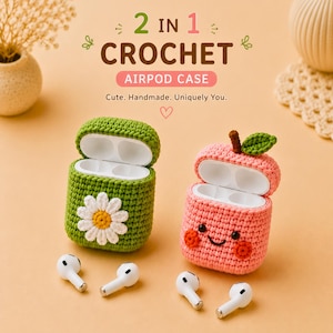 May include: Two crochet AirPod cases, one green with a daisy, the other pink shaped like an apple. The cases are open, revealing white interiors. The text reads "2 in 1 Crochet AirPod Case. Cute. Handmade. Uniquely You."